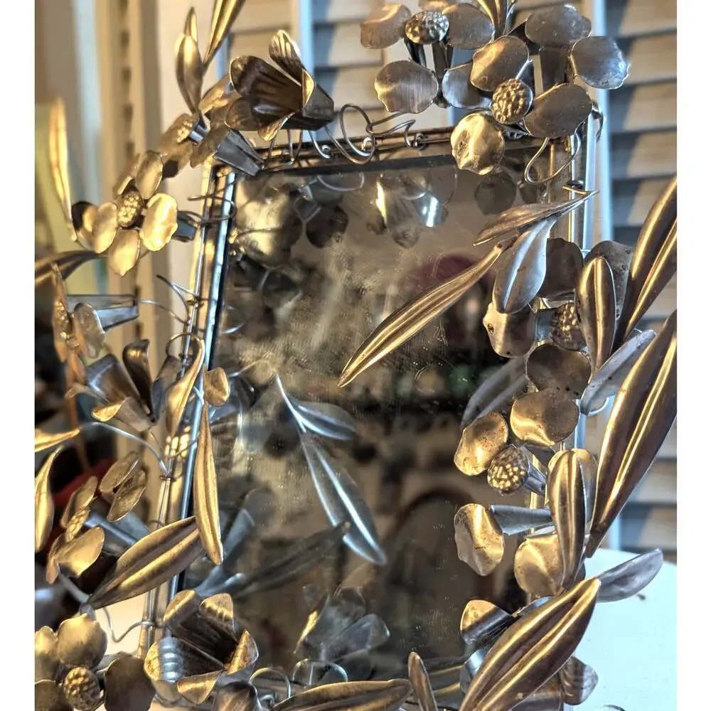 Vintage handcrafted silver-toned floral toleware mirror